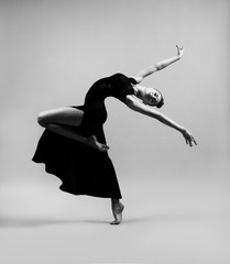 Flexible girl in a black dress