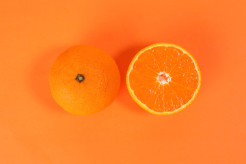 Mandarin Orange Fruit slice half on orange background