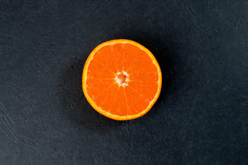 Mandarin Orange Fruit slice half on black background