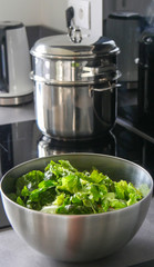 green salad in a stainless steel bowl