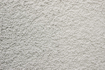 white lime plaster texture wall of a building, wallpaper backdrop , space for text