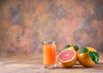 Glass of  fresh grapefruit juice on  a abstract  background.Selective focus.