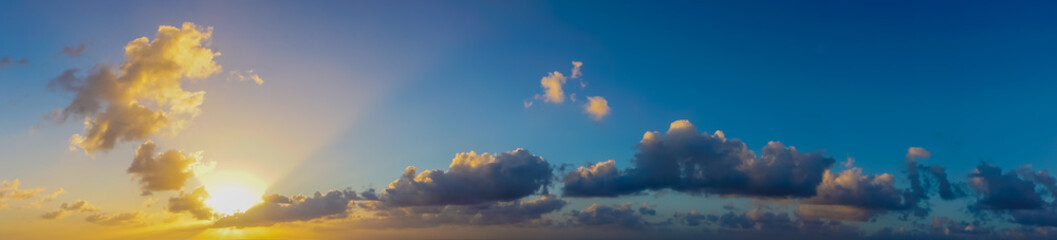 A beautiful sunset with clouds panorama