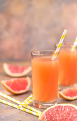 One glass with grapefruit juice selective focus.