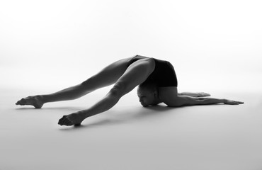 Flexible girl in black body.