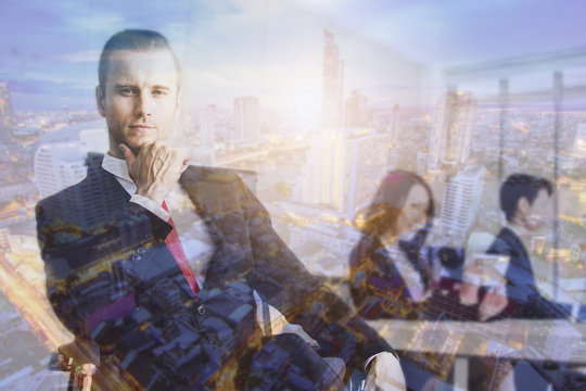 Double Exposure Looking Smart Businessman Sitting In Office Overlay With Night City