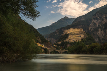 aosta old stone castle with river in north italy cloudy sky forte di bard