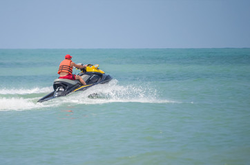 Fototapeta na wymiar lifeguard on a water scooter