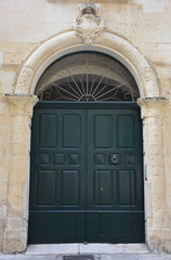 Fototapeta na wymiar Italy, Lecce, ancient buildings and streets of the old town, views and details, doors, windows and various architectures.