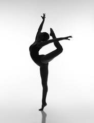 Flexible girl in blacklight