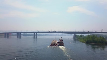Towboat heading north along the Enisey River in Krasnoyarsk drone footage
