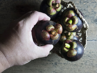 Mangosteen handles placed on wooden boards.