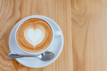 Cappuccino or Latte coffee art cup with heart shaped.