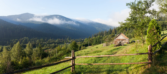 Fototapeta na wymiar House in mountain village, forest nature landscape.
