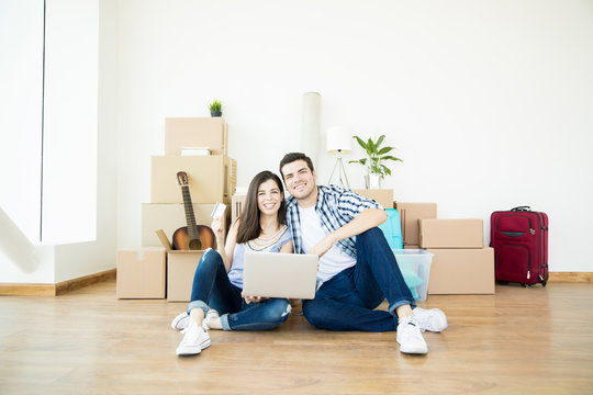 Man And Woman Doing Online Shopping For New Home