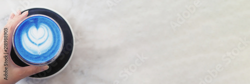 Banner Of Top View Of A Woman S Left Hand Grabbing A Cup Of Hot