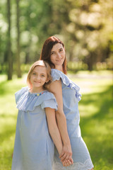 Naklejka premium Happy mother and daughter in the park