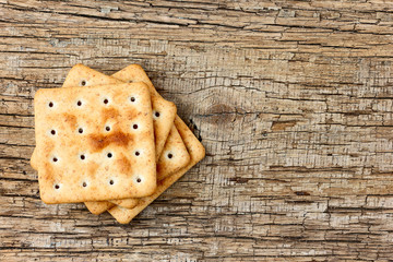 Crackers on a wooden background.