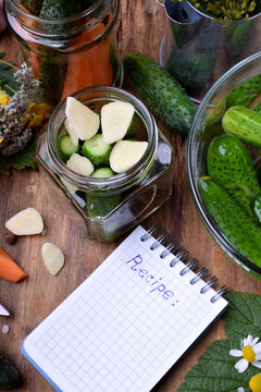 Process of cooking pickled cucumbers with garlic and spices. Making up a recipe