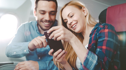 On a Commercial Plane Flight Handsome Hispanic Man Tells Funny Story to His Beautiful Blonde...