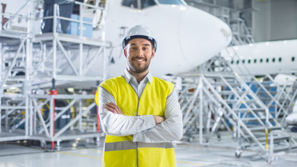 Naklejka premium Portrait of Aircraft Maintenance Mechanic in Safety Vest
