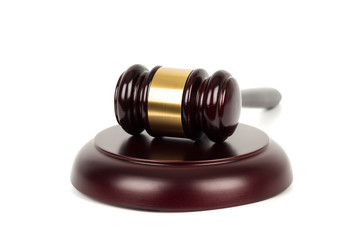 Wooden judge gavel and soundboard on white background