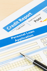 Personal loan application form poor credit score with pen