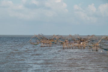 Fototapeta na wymiar Landscape of fisherman's village in Thailand with a number of fishing tools called 
