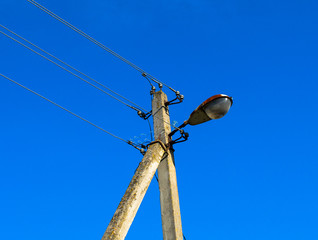 power line post with lighting lamp