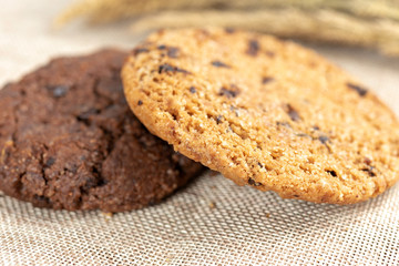Chocolate cookies on wooden table.