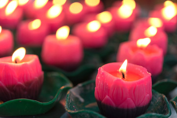 Flower candles burning at night.