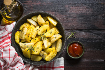 Baked potato with herbs top view.