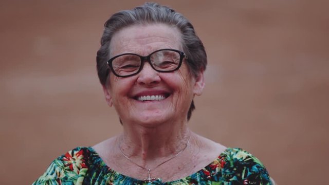 Smiling Elderly Woman Looking At Camera