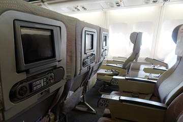 The interior of an empty aircraft, ready to fly cabin airliner with rows of seats.