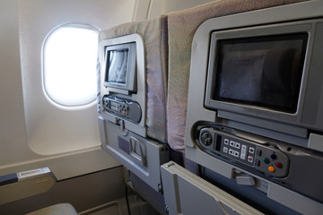 The interior of an empty aircraft, ready to fly cabin airliner with rows of seats.