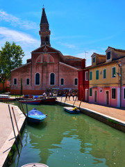 Fototapeta na wymiar The romantic houses painted in brilliant pastel shades on the Island of Burano Italy