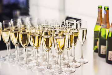 Champagne flutes glasses on a party.  Wedding or new year eve celebration concept