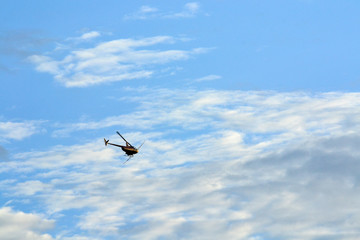 helicopter flying in blue sky