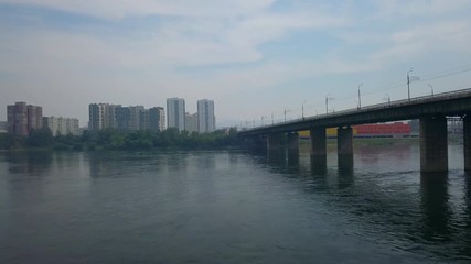Aerial view of bridge over the river Yenisei in Krasnoyasrk city drone footage