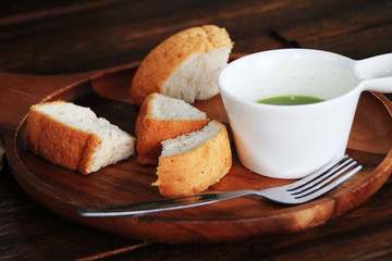 Steam bread and green tea sauce put in the wood tray