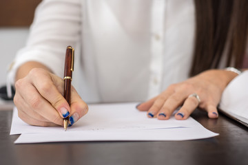 Business woman signing important documents
