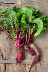 fresh organic beets on wooden background