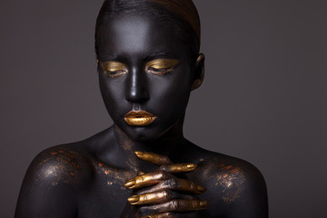 Portrait of a beautiful girl with creative, fantasy make-up.