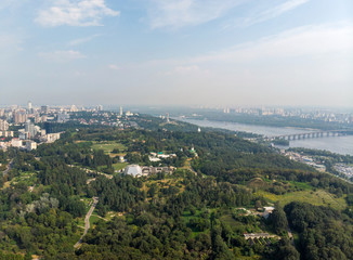 Fototapeta na wymiar Aerial view Panorama of Kiev city above the National Botanical Garden named after M.M. Grishka.