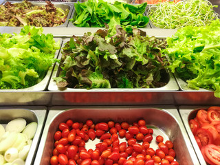 fresh organic close up of salad bar with various  vegetables at supermarket, clean food, good for your health