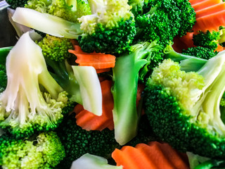 fresh organic close up of steamed vegetables,  broccoli and carrot, clean food for cookling, for make salad