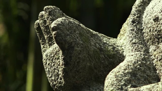 Close up of ancient statue that appears to be the hand raised up. Shallow depth of field