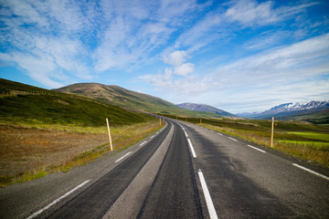 Typical Icelandic landscape with asphalt road. 