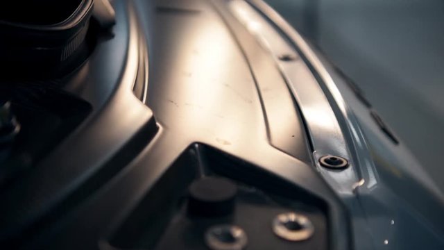 Man screwing car bumper
