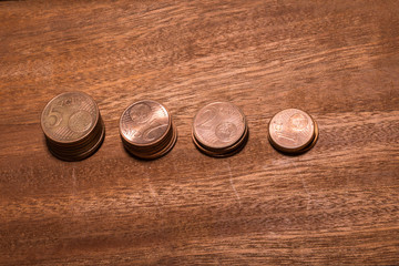Stack of money coins isolated on wood